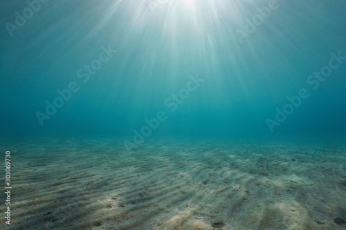 Sand underwater on the seabed with sunlight, natural scene, Mediterranean sea