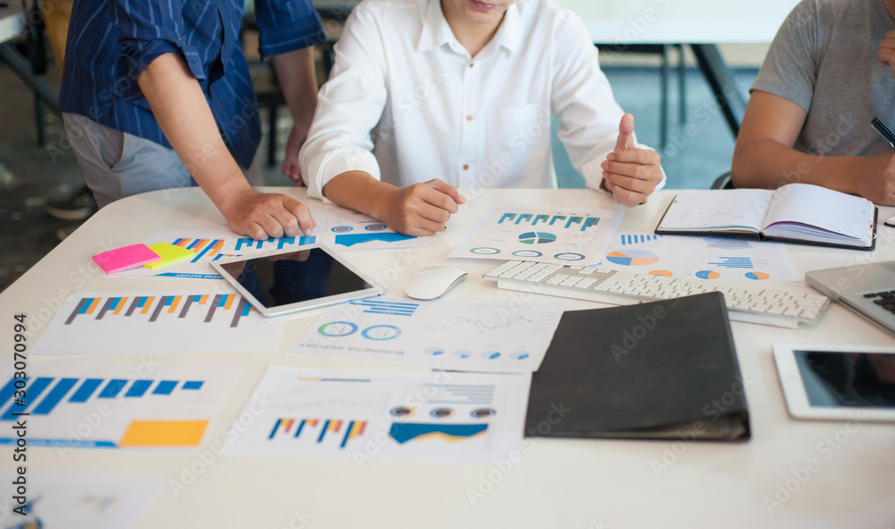 Young business people brainstorm ideas to analyze strategies and plan capital outcomes for good profits. Young business people brainstorm ideas to analyze strategies and plan capital outcomes for good profits.