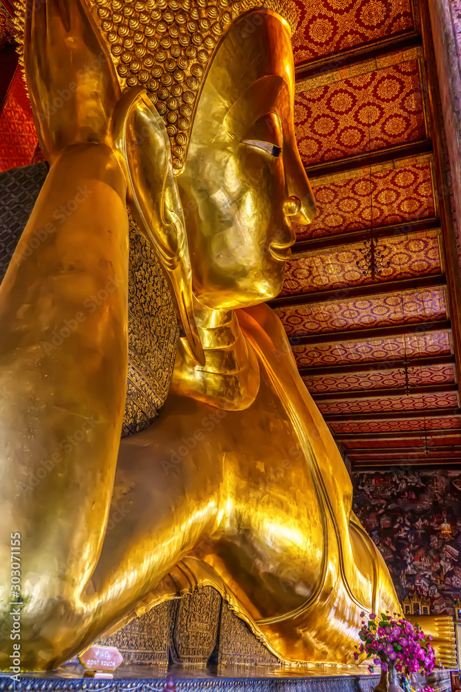 A large Reclining Buddha is one landmark of Wat Phra Chettuphon Wimon Mangkhalaram Ratchaworamahawihan in Bangkok, Thailand. A place everyone in every religion can be viewed.