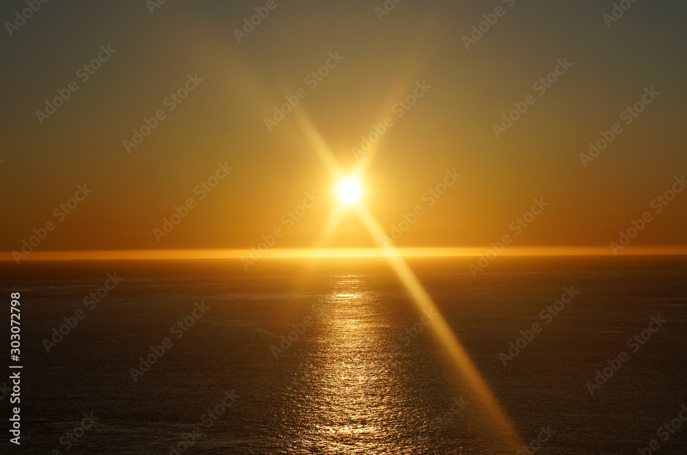 Tranquil scene orange sun and sky sunset over the ocean at pacific west coast san francisco united states USA - beautiful natural texture background concept 