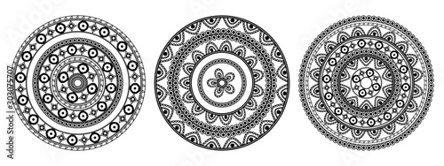 A set of three black mandalas on a white background. Oriental ornament for placing on fabric, wallpaper, wrapping paper, dishes. Template for painting henna, tattoos. Vectorial anti-stress