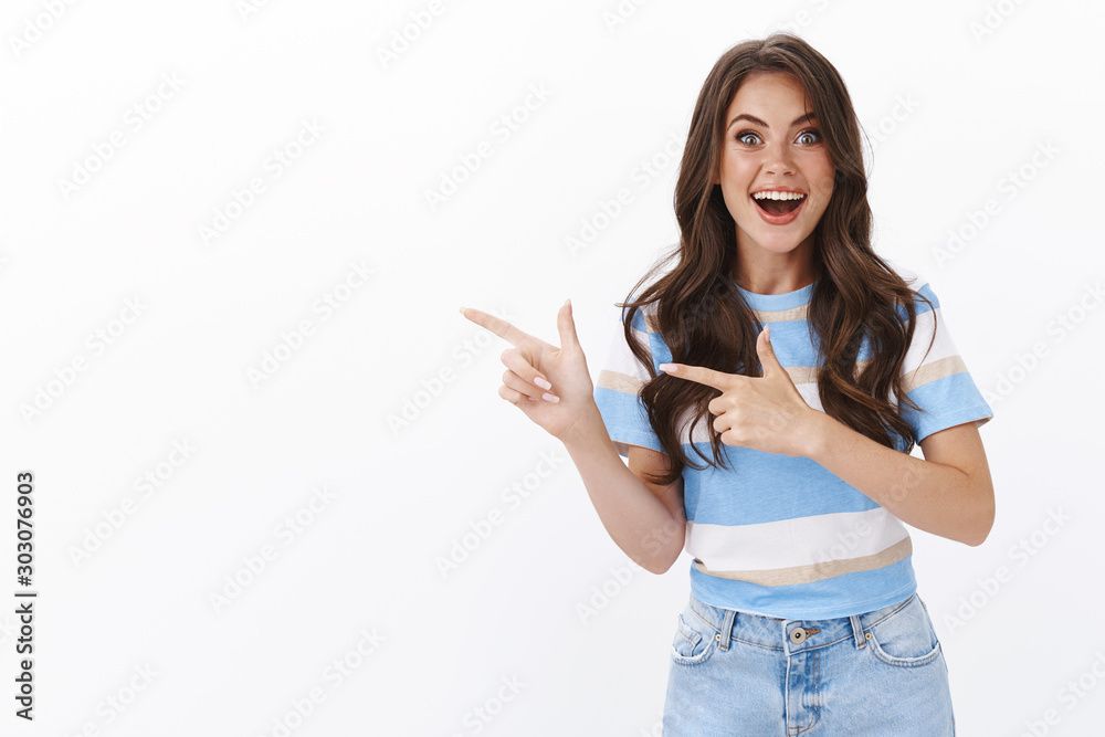 Happy charismatic amused european woman share excellent news, pointing fingers left and smiling excited, open mouth fascinated explain cool copy space promo, stand white background astonished Happy charismatic amused european woman share excellent news, pointing fingers left and smiling excited, open mouth fascinated explain cool copy space promo, stand white background astonished