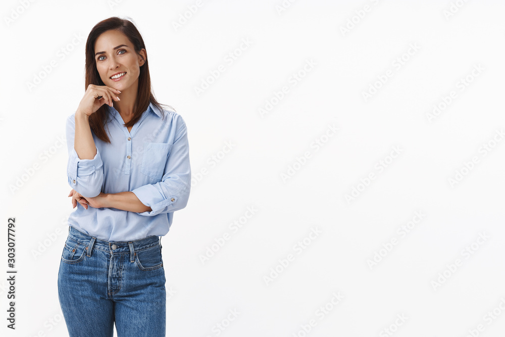 Joyful carefree adult female smiling friendly, stand casual relaxed pose blue-collar shirt, touch face tilt head, look interested delighted hear interesting conversation, stand white background Joyful carefree adult female smiling friendly, stand casual relaxed pose blue-collar shirt, touch face tilt head, look interested delighted hear interesting conversation, stand white background