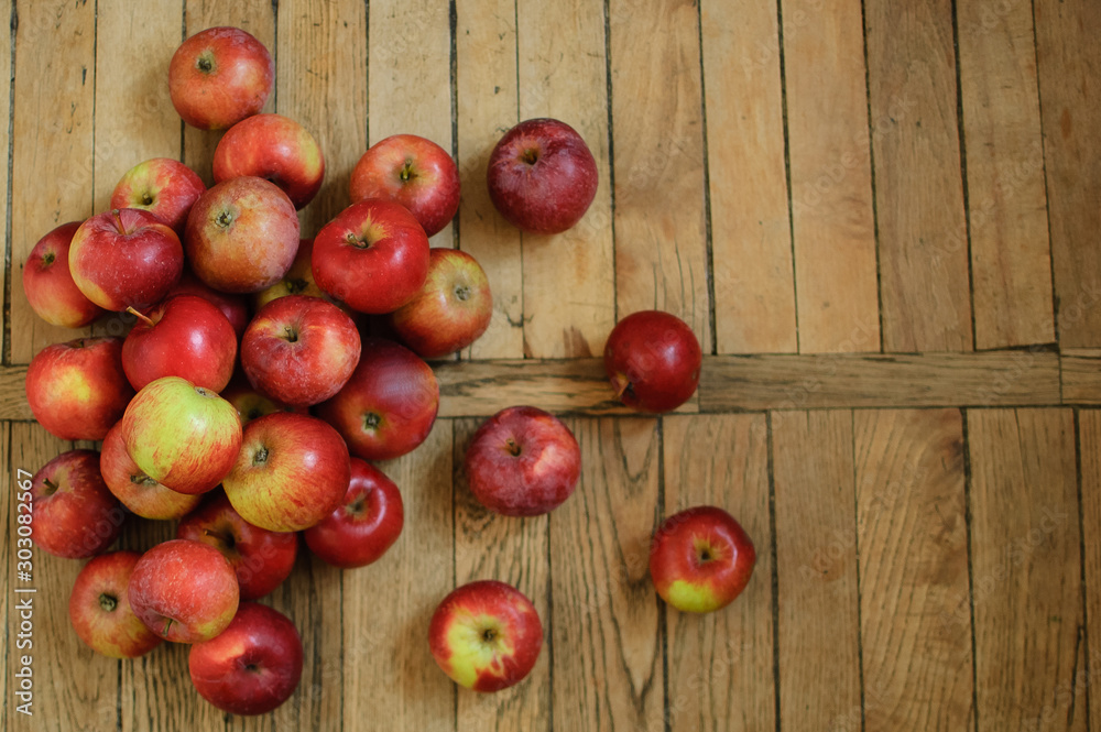 Top view of ripe red juicy apples on wooden background, healthy eating concept, copy space Top view of ripe red juicy apples on wooden background, healthy eating concept, copy space