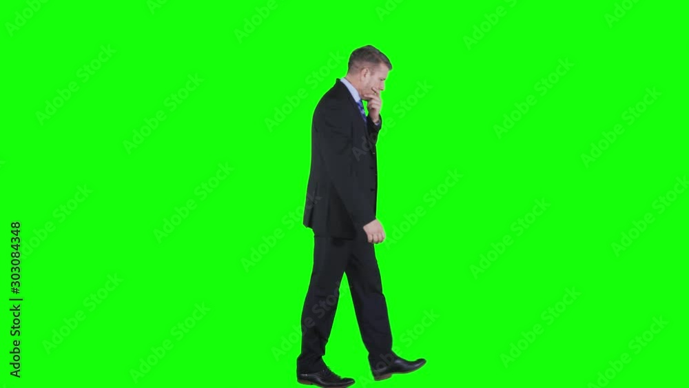 Confused Caucasian businessman thinking something and walking back and forth in the studio. Shot in 4k resolution with green screen background Confused Caucasian businessman thinking something and walking back and forth in the studio. Shot in 4k resolution with green screen background