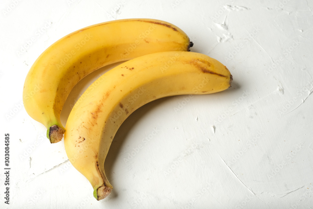 Bananas ugli on a light background copy space. Bananas ugli on a light background copy space.