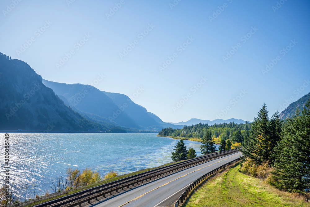 Railway track and vehicles road along the Columbia River in Columbia Gorge