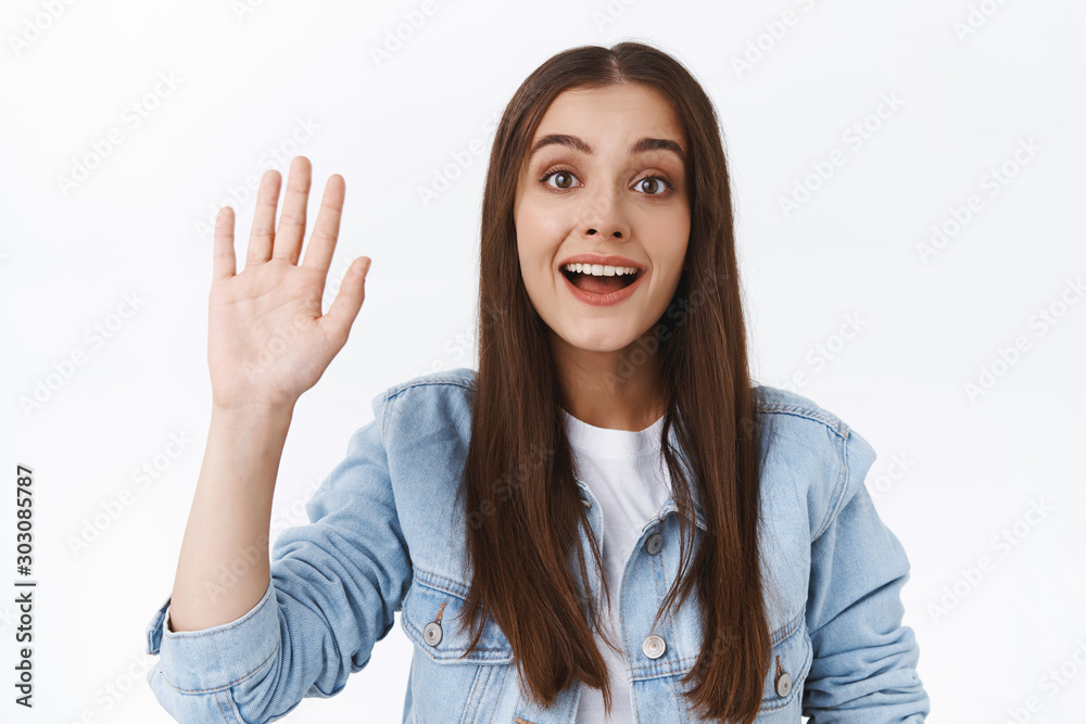 Friendly young shy female trying to greet cute girl in cafe to get her number, waving hand in hello or hi gesture, smiling hopeful and cute, welcoming somone, white background Friendly young shy female trying to greet cute girl in cafe to get her number, waving hand in hello or hi gesture, smiling hopeful and cute, welcoming somone, white background