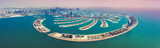 Aerial view on Palm Jumeira island in Dubai, UAE, on a summer day.