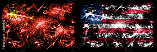 China, Chinese vs Liberia, Liberian New Year celebration travel sparkling fireworks flags concept background. Combination of two abstract states flags. © Vlad