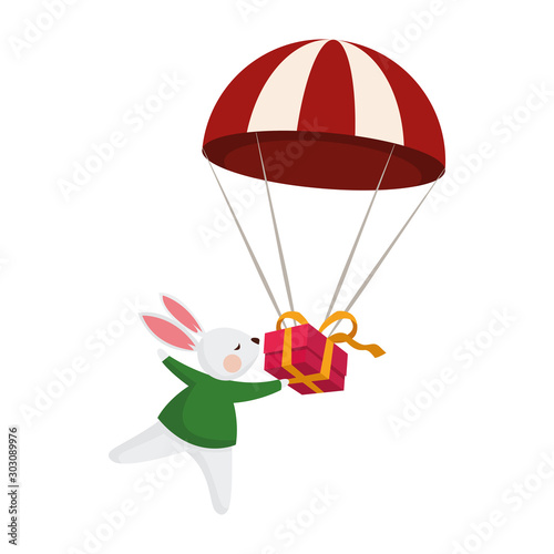 Fototapeta Naklejka Na Ścianę i Meble -  cute rabbit with parachute with gift box icon