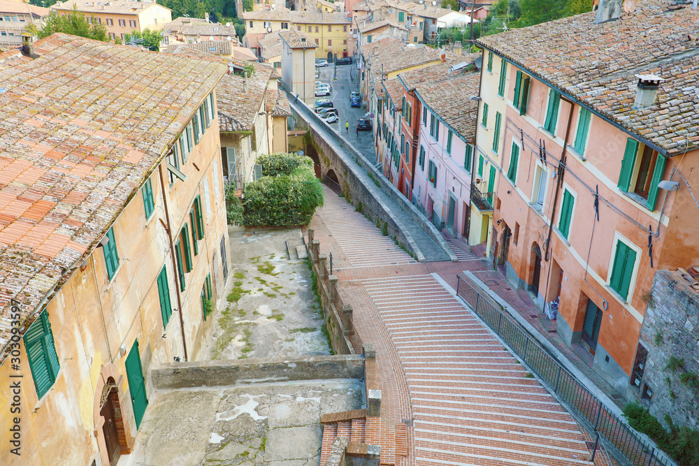 Panoramic view of the historic aqueduct forming Via dell Acquedotto pedestrian street along the ancient Via Appia street in Perugia historic quarter, Italy.