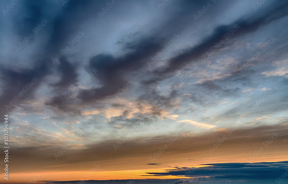 Fantastic dark blue thunderclouds at sunrise, natural composition