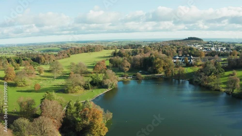 Aerial Flight Over  Castlewellan forest park Lake area countryside Northern Ireland during Autumn time. Hiking And Tourism Concept photo