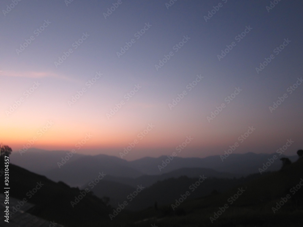 Landscape of mountain, beautiful twilight sky during sunrise for relaxing travel destination in Thailand in winter season.