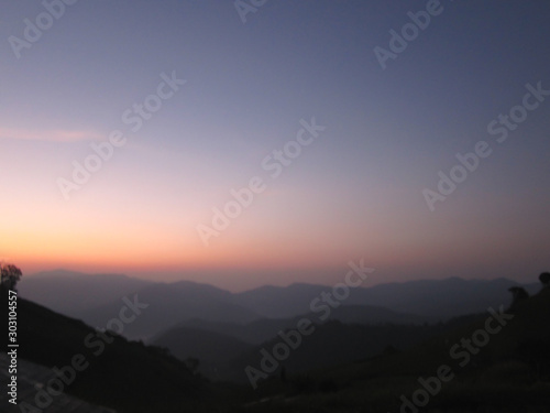 Landscape of mountain, beautiful twilight sky during sunrise for relaxing travel destination in Thailand in winter season. © Namphueng
