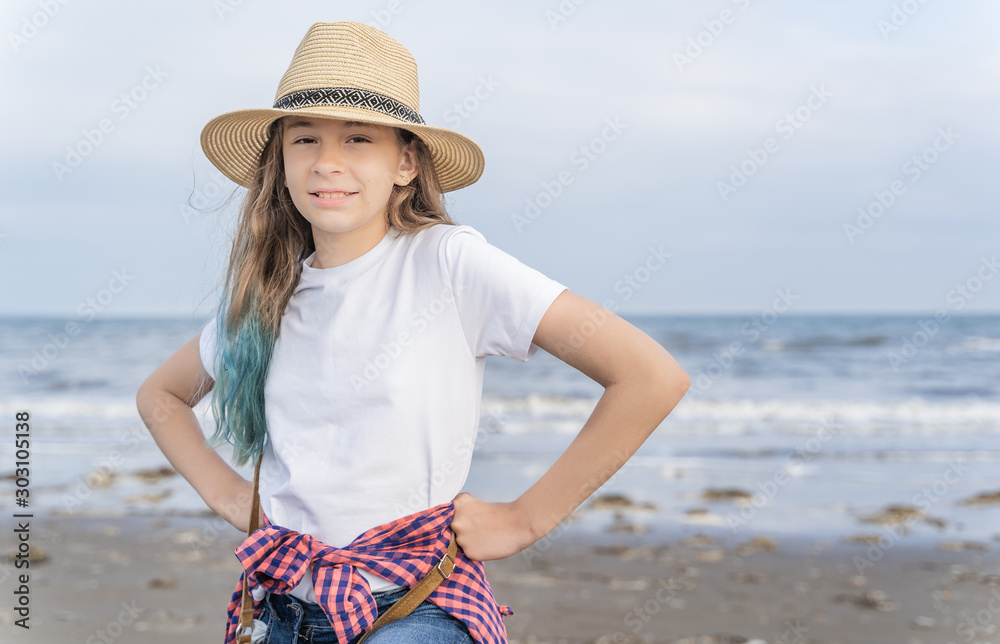 Charming girl by the sea