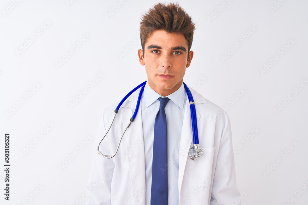 Young handsome doctor man wearing stethoscope over isolated white background Relaxed with serious expression on face. Simple and natural looking at the camera. Young handsome doctor man wearing stethoscope over isolated white background Relaxed with serious expression on face. Simple and natural looking at the camera.