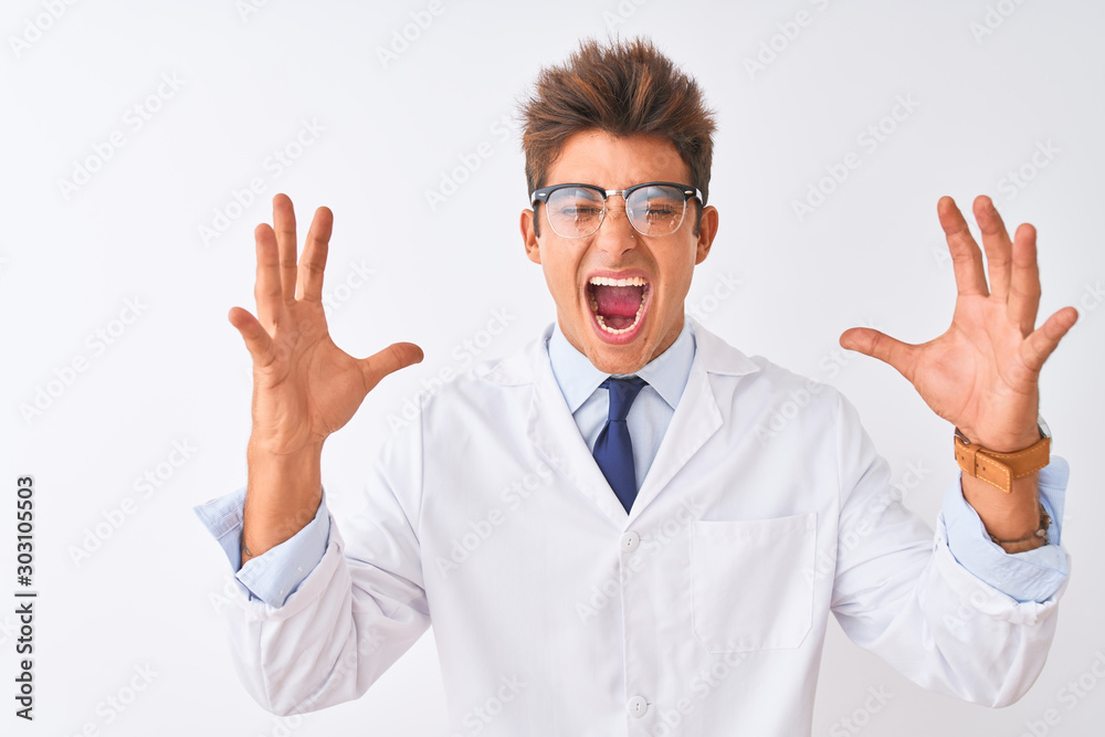 Young handsome sciencist man wearing glasses and coat over isolated white background celebrating mad and crazy for success with arms raised and closed eyes screaming excited. Winner concept Young handsome sciencist man wearing glasses and coat over isolated white background celebrating mad and crazy for success with arms raised and closed eyes screaming excited. Winner concept