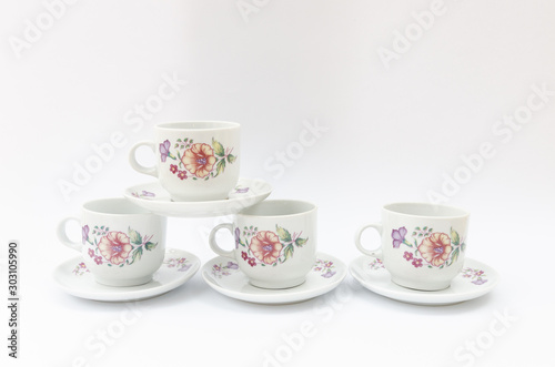 Porcelain coffe or tea cups with floral pattern isolated - retro midcentury classic mass product china ware
