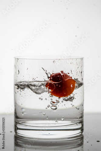  splashing water from a tomato in a whiskey glass8