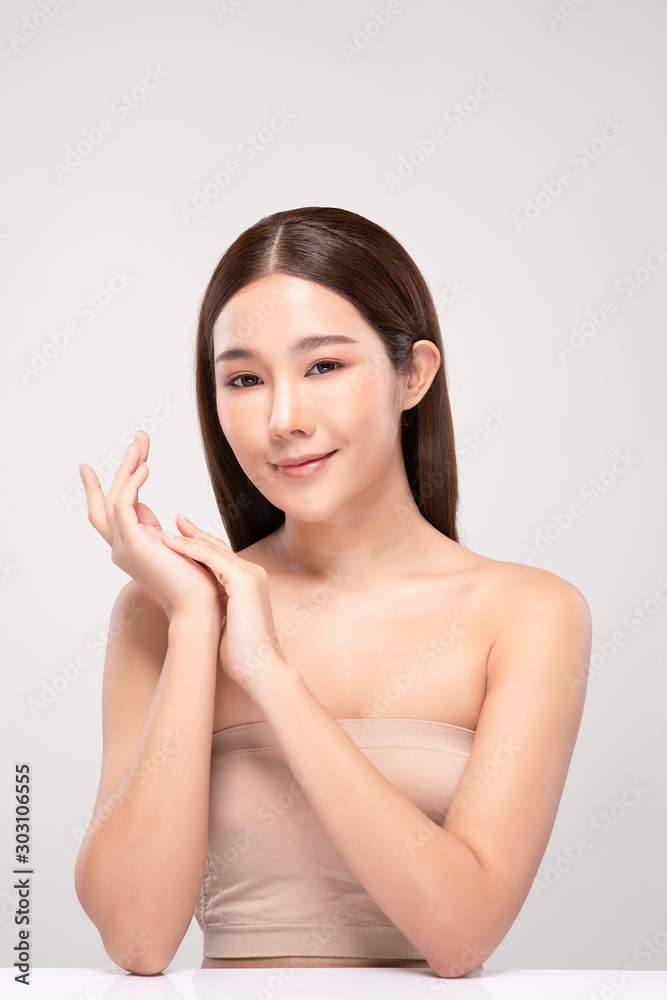 Beautiful Asian young woman holding hands smile with clean and fresh skin Happiness and cheerful with positive emotional,isolated on gray background,Beauty and Cosmetics Concept Beautiful Asian young woman holding hands smile with clean and fresh skin Happiness and cheerful with positive emotional,isolated on gray background,Beauty and Cosmetics Concept