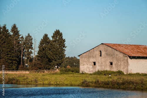 old barn at a lake