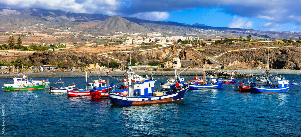 Tenerife holidays. Playa San Juan -pictorial beach with traditional boats . Canary islands