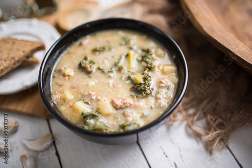 Sausage and kale zuppa toscana italian creamy soup photo