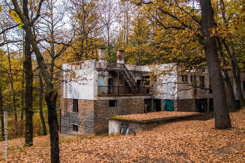 Ruined and abandoned hotel by the Tresnja lake in Serbia photo