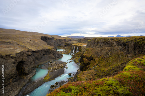 Beautiful landscape of Sigoldugljufur canyon with many small waterfalls and the blue river in Highlands of Iceland