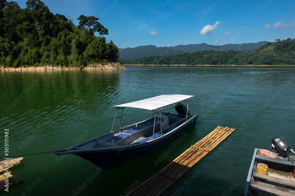 fiber speed boat floating near the boathouse.boat is main transportation at Banding Lake located in Perak State, Malaysia