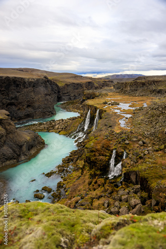 Beautiful landscape of Sigoldugljufur canyon with many small waterfalls and the blue river in Highlands of Iceland photo