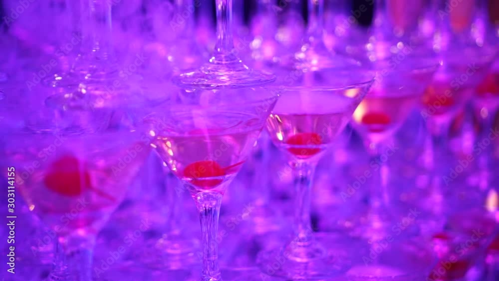 The pyramid (the tower) from glasses poured with champagne The pyramid (the tower) from glasses poured with champagne