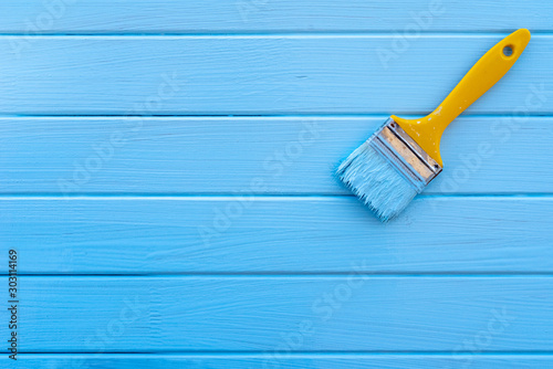 Obraz na płótnie paint brush on wood background w salonie