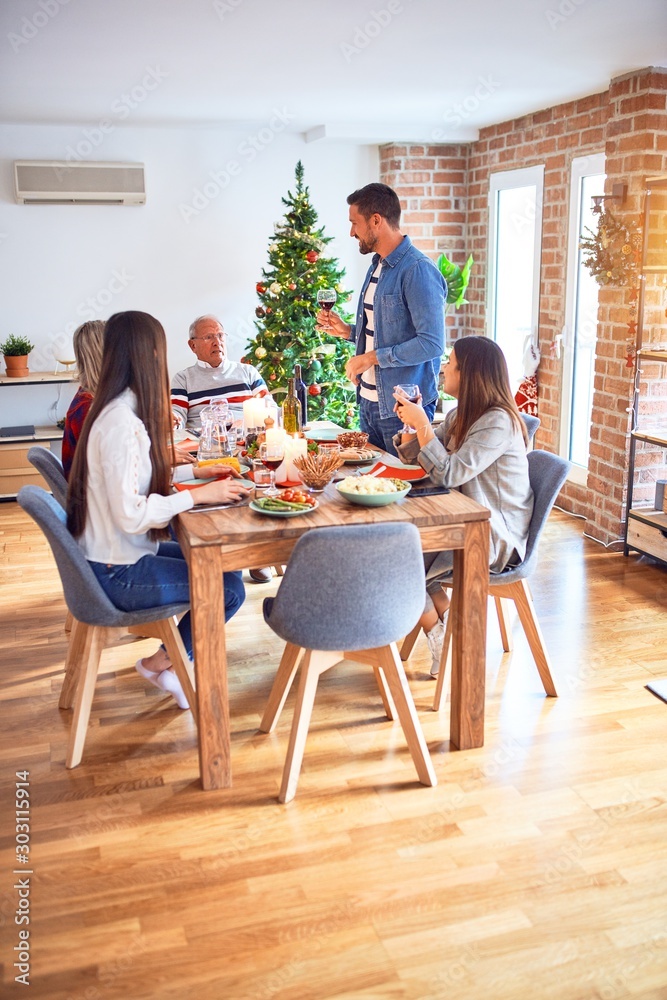 Beautiful family meeting smiling happy and confident. Speaking speech eating roasted turkey celebrating Christmas at home Beautiful family meeting smiling happy and confident. Speaking speech eating roasted turkey celebrating Christmas at home