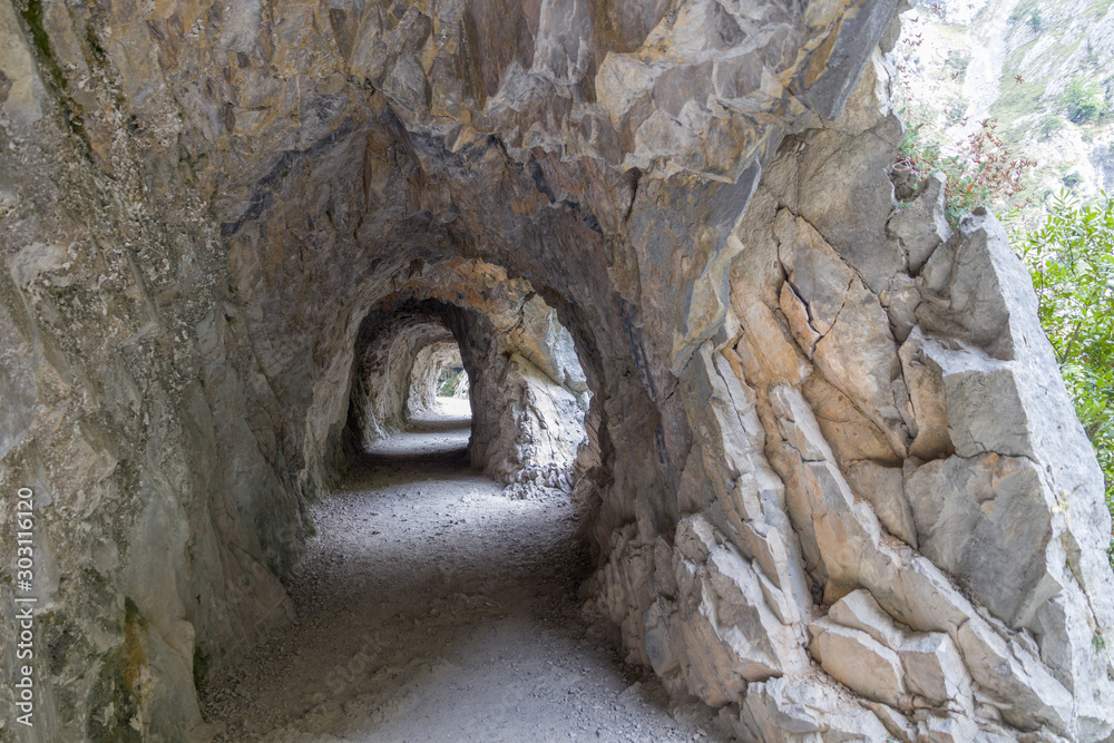 Rocks tunnels in mountain pathway