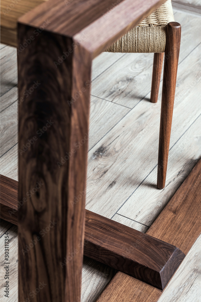 Close up of design oak wooden table and elegant accessoreis. Details of family table. Indusrtial concept of dining room. Open space. Template. 