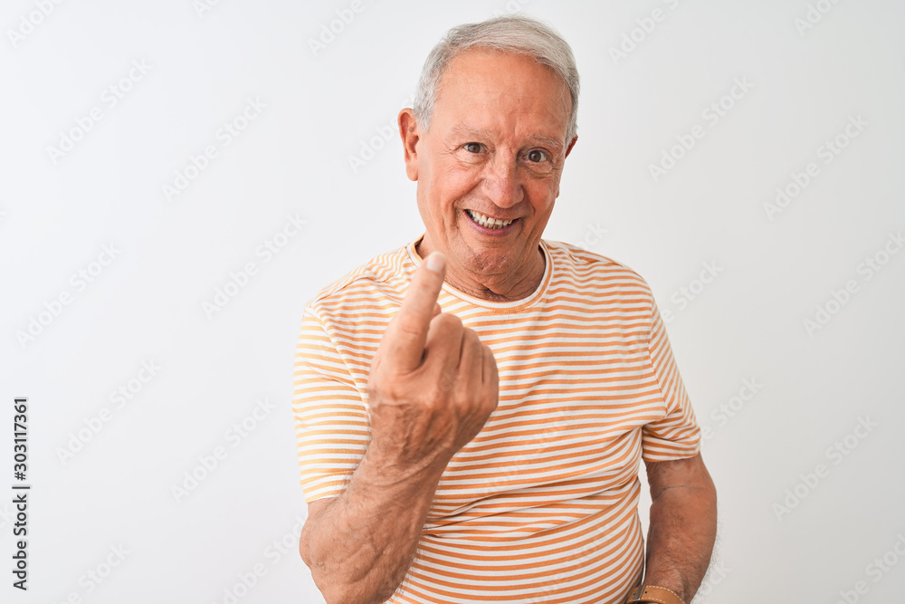Senior grey-haired man wearing striped t-shirt standing over isolated white background Beckoning come here gesture with hand inviting welcoming happy and smiling