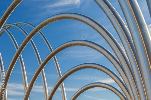 Abstract steel pipes rising into the sky