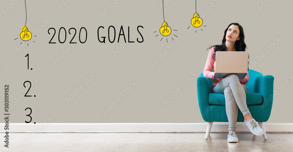 2020 goals with young woman using a laptop computer - obrazy, fototapety, plakaty 