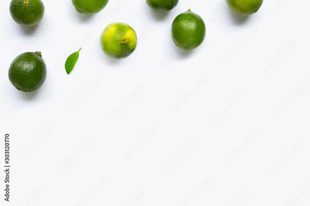 Limes with leaf isolated on white Limes with leaf isolated on white