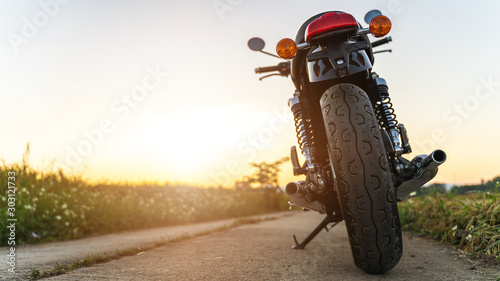 Fototapeta Naklejka Na Ścianę i Meble -  motorcycle in a sunny motorbike on the road. with sunset light. copyspace for your individual text. 
