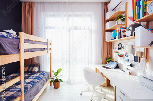 modern bright kids room with bunk bed and wall shelves © Olesia Bilkei