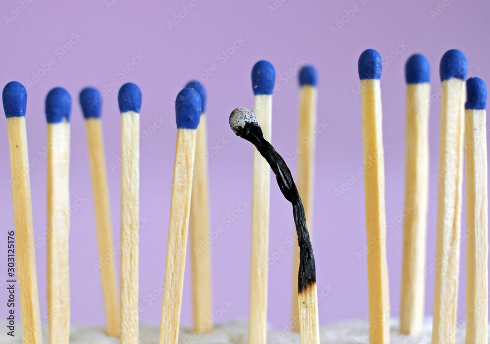 Burnout matches, one burned out grey very close. Burnout and stress Burnout matches, one burned out grey very close. Burnout and stress
