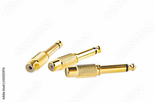 Close up of golden RCA audio adapter plug isolated on white background. Image stack