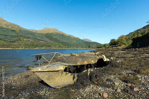 Abandoned Fishing boat on loch long in the Trossachs National Park