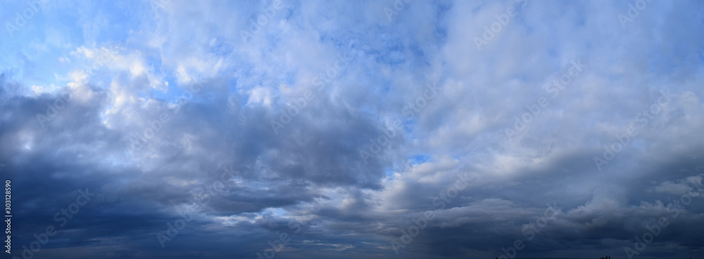 Big summer clouds. Atmospheric phenomenon - the vapor state of water. Panoramic photo