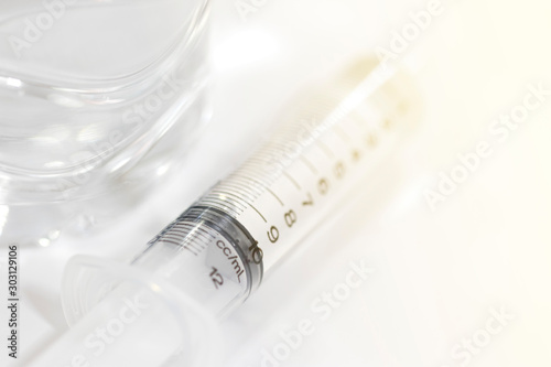 Syringes and saline solution for nasal wash.