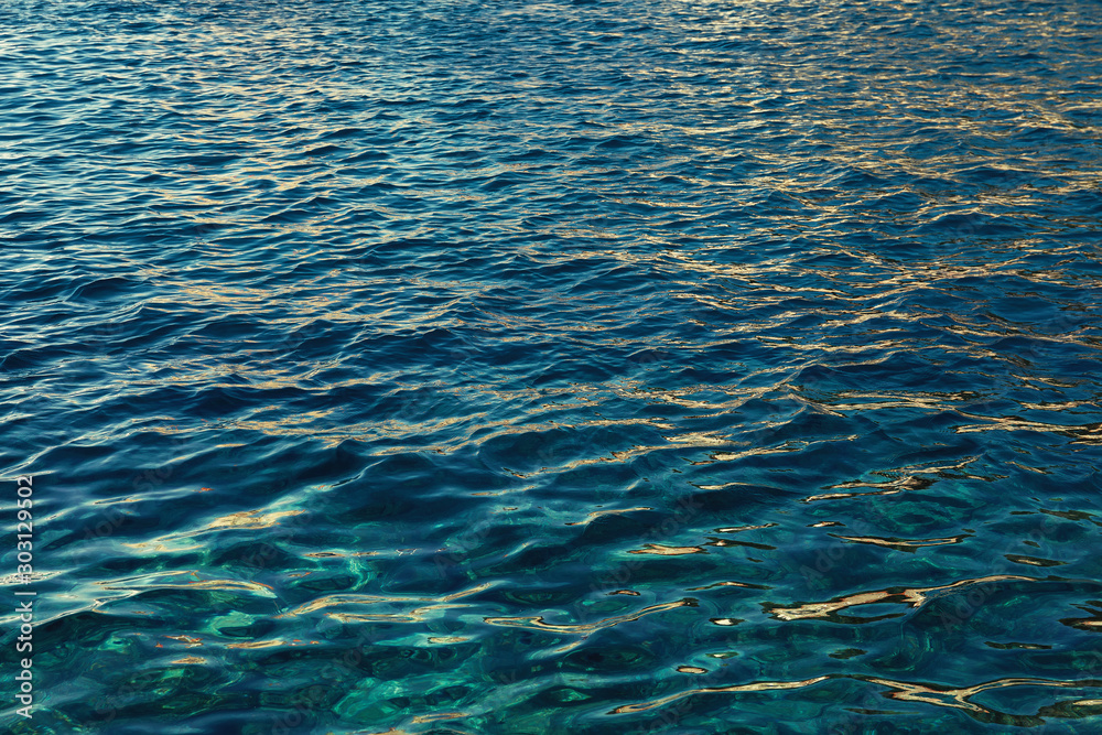 Obraz premium Dark turquoise wavy water surface ripple background